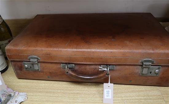 A vintage leather suitcase by John Pound & Co, Regent Street